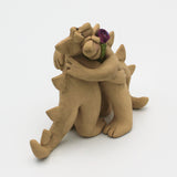 Two Beasts Hugging Sculpture By Susan Press