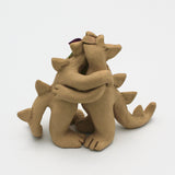 Two Beasts Hugging Sculpture By Susan Press