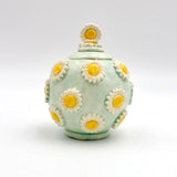 Daisy Container By Geraldine GaNun